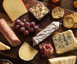 Wooden board of cheese